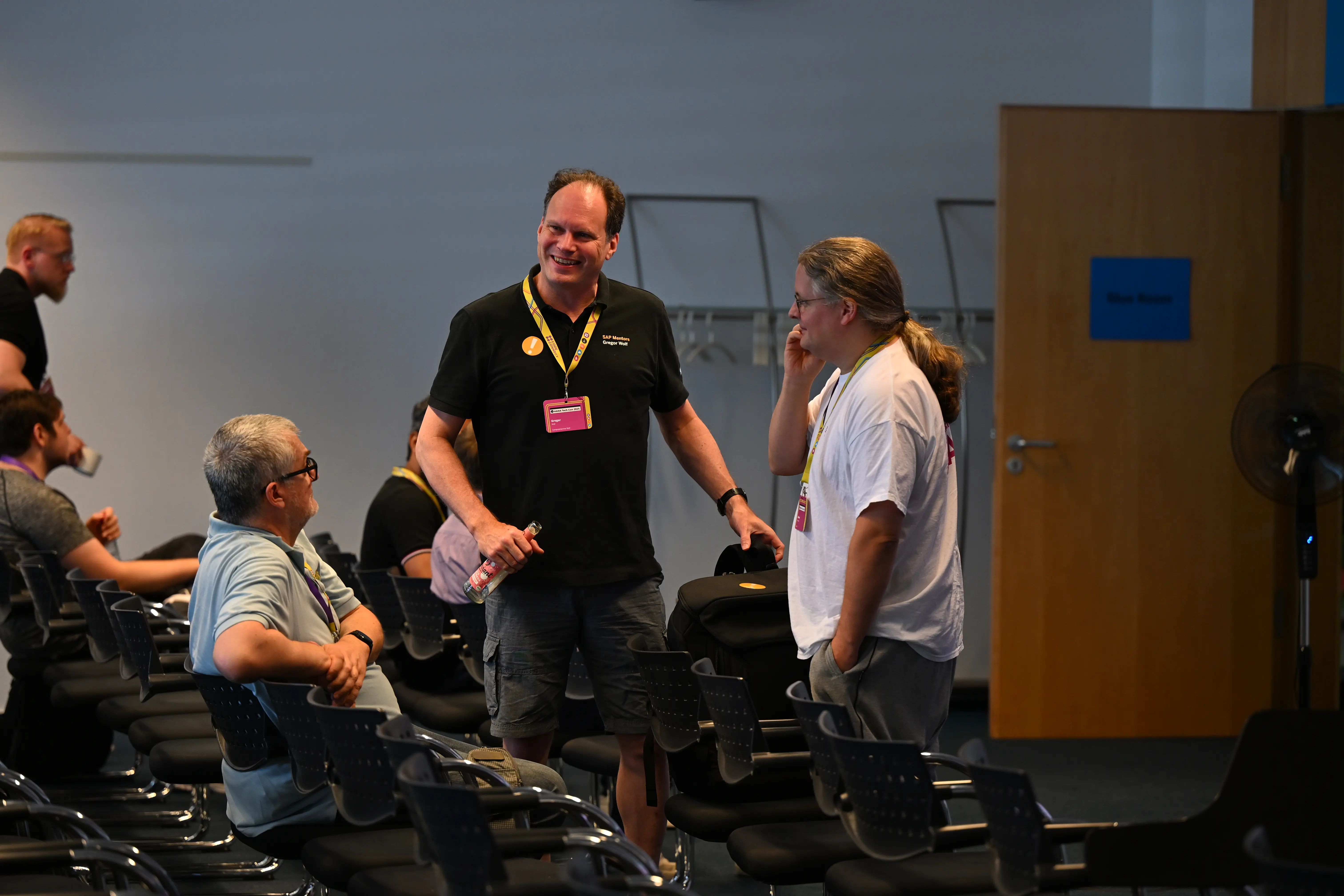 A man standing in front of a projector and giving a talk